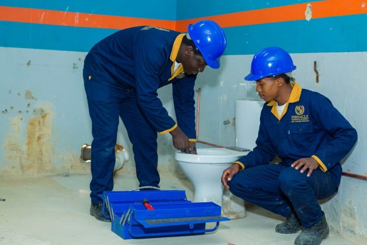 Students repairing toilet and drainage plumbing at Pinnacle Technical Academy Johannesburg