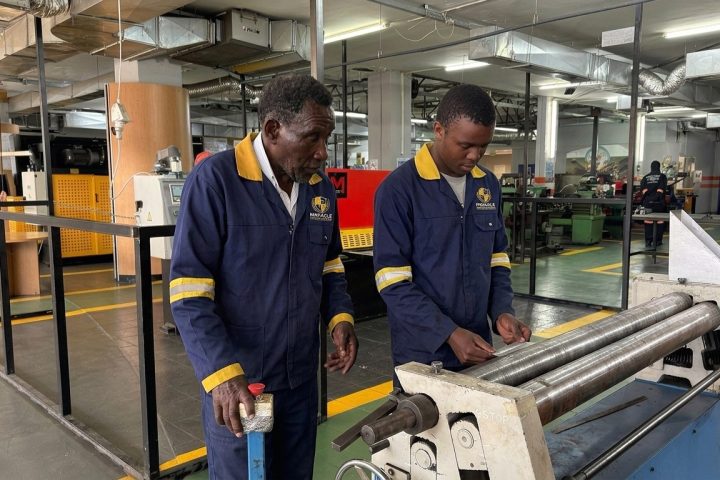 Boilermaker students using a plate rolling machine at Pinnacle Technical Academy Johannesburg