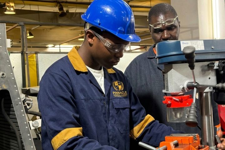 Workshop tool assistant student at a drill press with an instructor at Pinnacle Technical Academy Johannesburg